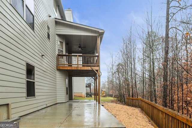 exterior space featuring ceiling fan and a patio