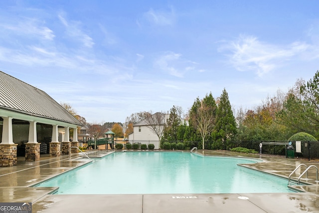 view of pool featuring a patio