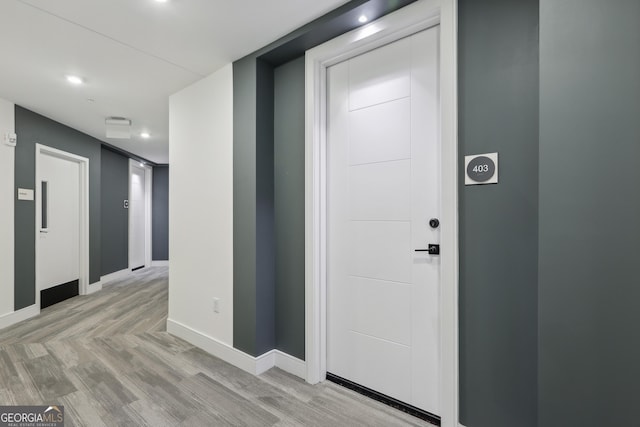 foyer entrance with light wood-type flooring