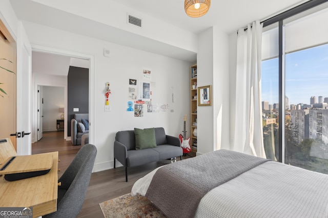 bedroom featuring dark hardwood / wood-style flooring