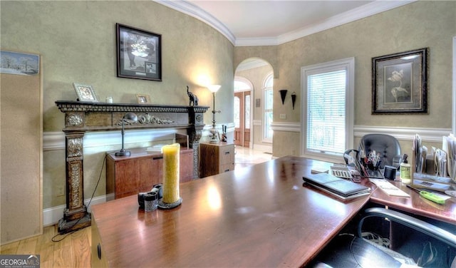 office area featuring crown molding and light hardwood / wood-style flooring