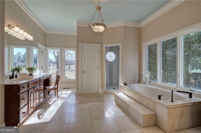 bathroom featuring tiled bath, crown molding, tile patterned flooring, and vanity