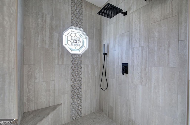 bathroom featuring tiled shower