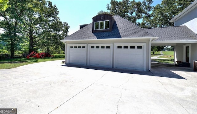 garage featuring a yard