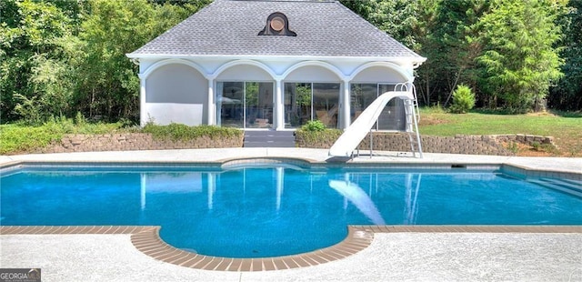 view of pool featuring a water slide