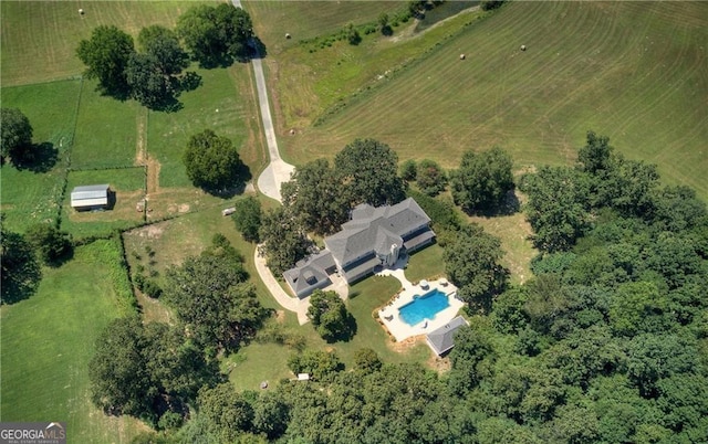 birds eye view of property featuring a rural view