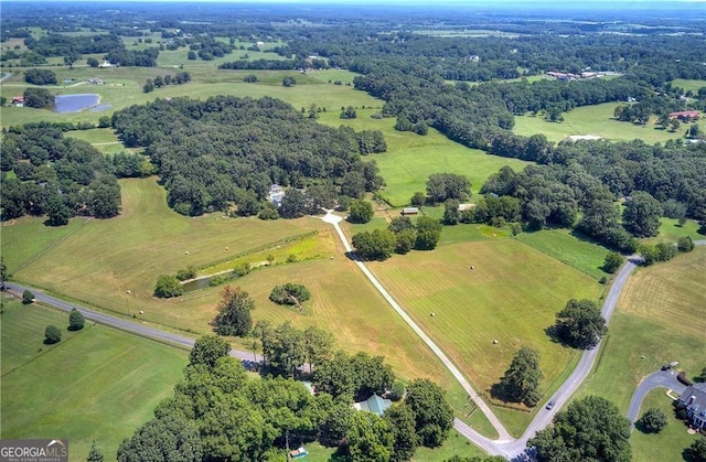 drone / aerial view with a rural view and a water view