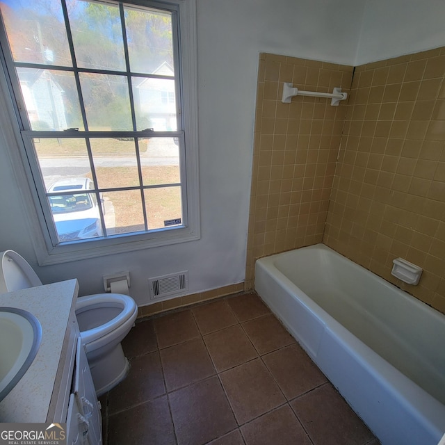 bathroom with tile patterned floors, vanity, and toilet