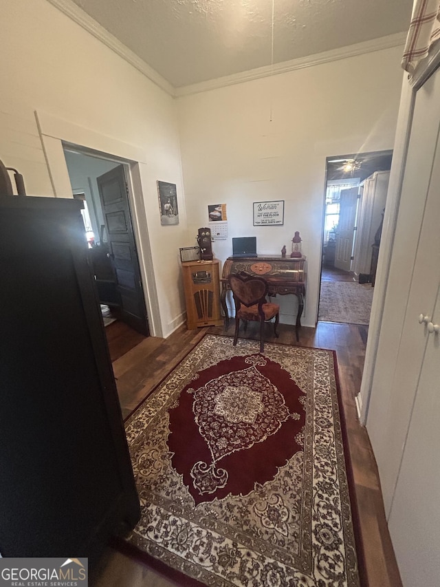 hall with crown molding and dark wood-type flooring