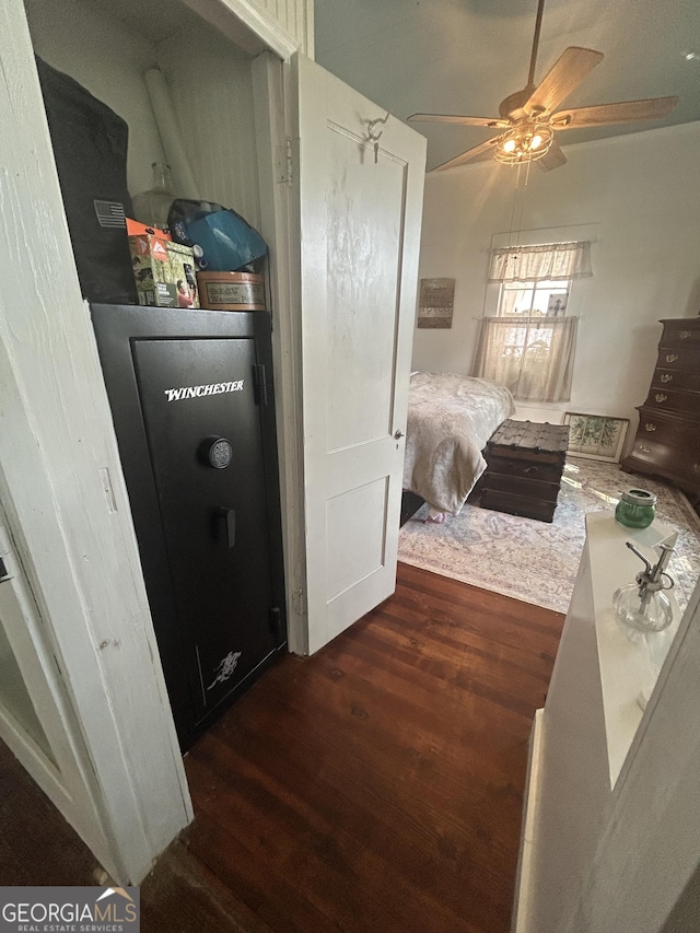 bedroom with ceiling fan and dark wood-type flooring