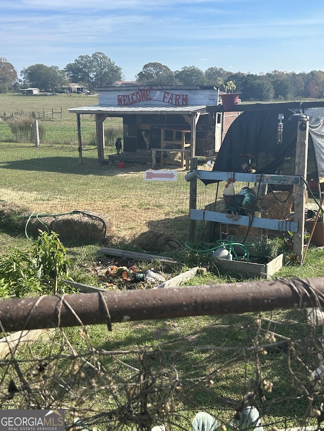 view of yard with a rural view