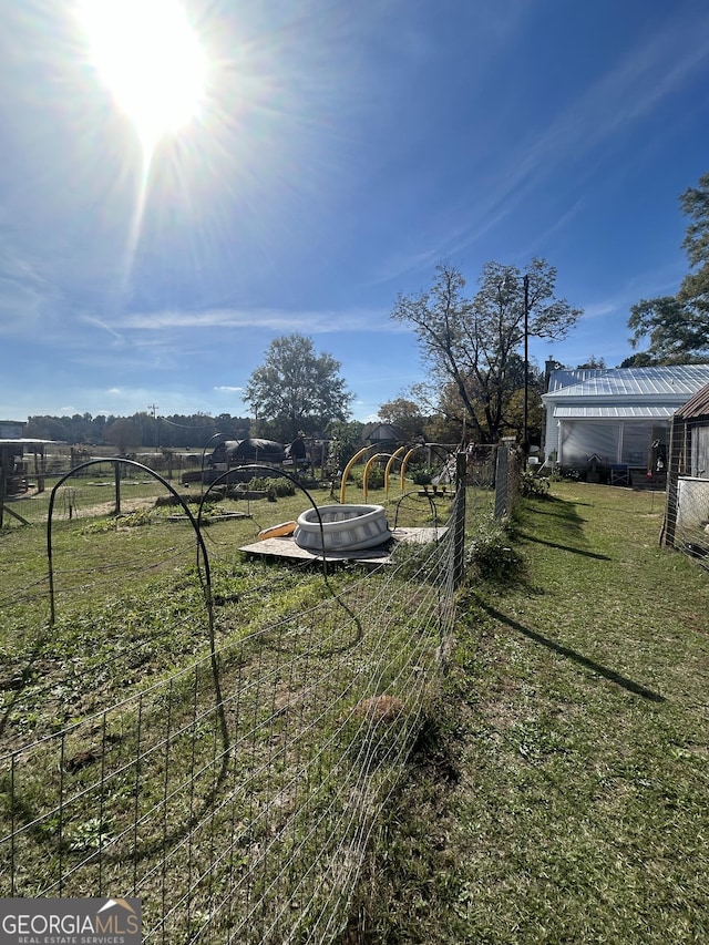 view of yard with a rural view