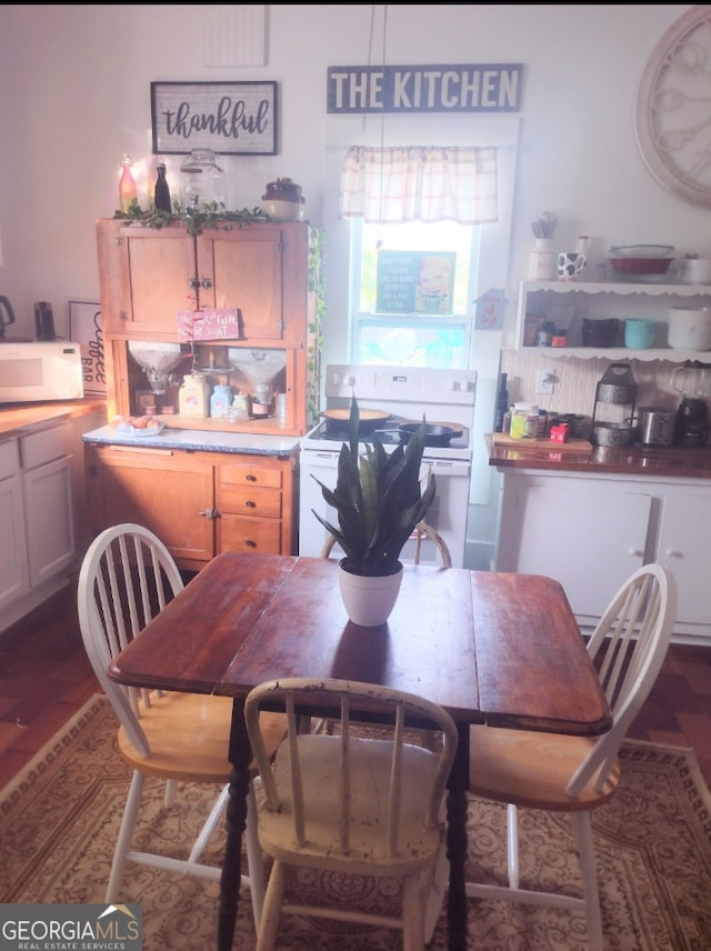 dining area with dark wood-type flooring