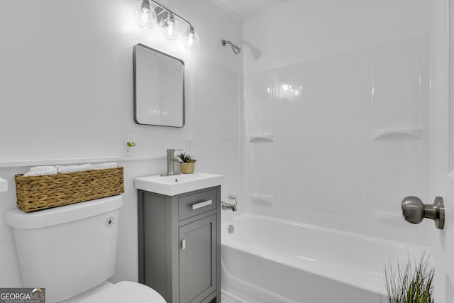 full bathroom featuring vanity,  shower combination, toilet, and ornamental molding