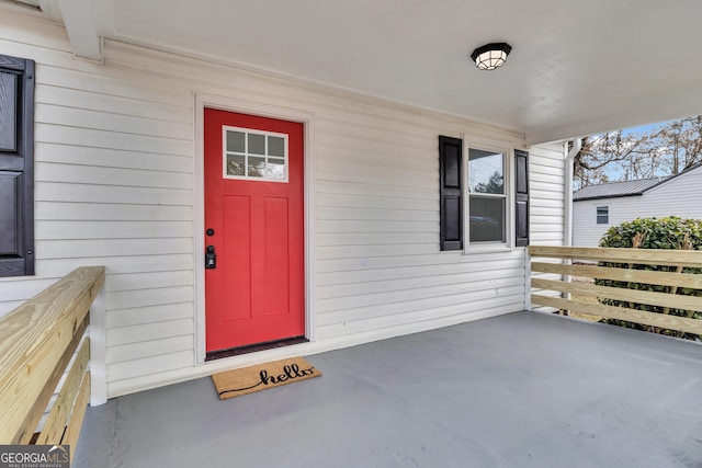 doorway to property featuring covered porch