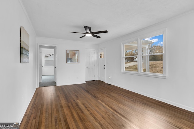 unfurnished living room featuring hardwood / wood-style flooring, ceiling fan, and ornamental molding