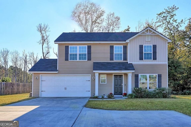 view of front facade with a front yard and a garage