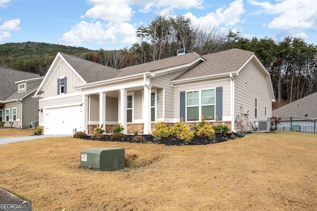 view of front facade with central AC and a front lawn