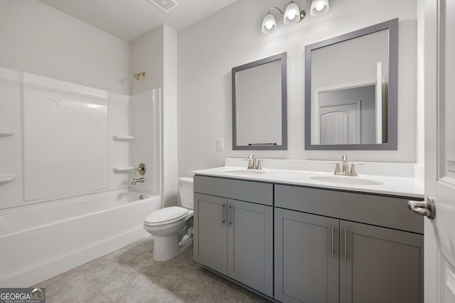 full bathroom with toilet, tile patterned floors, vanity, and bathing tub / shower combination