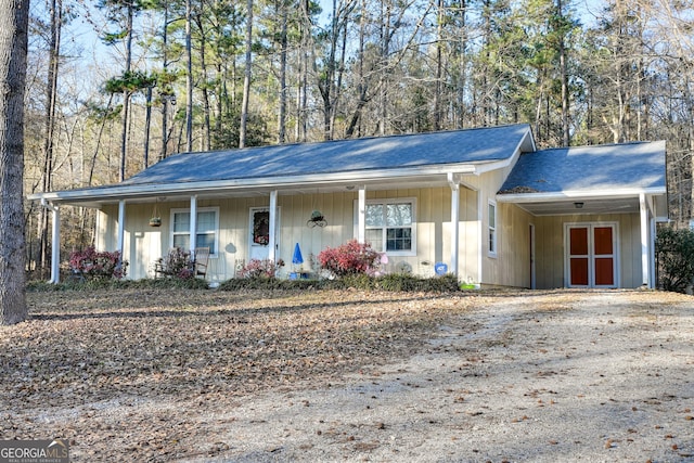 ranch-style home featuring a carport