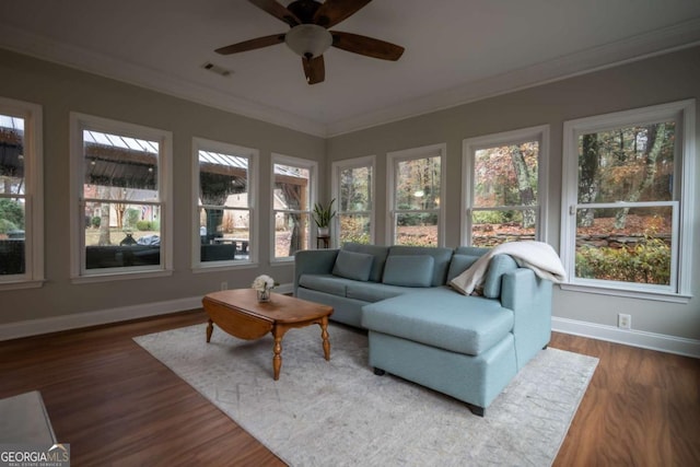 sunroom / solarium with ceiling fan and a wealth of natural light