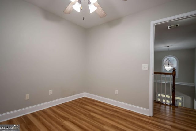 unfurnished room featuring wood-type flooring and ceiling fan