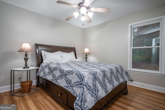 bedroom featuring ceiling fan and wood-type flooring