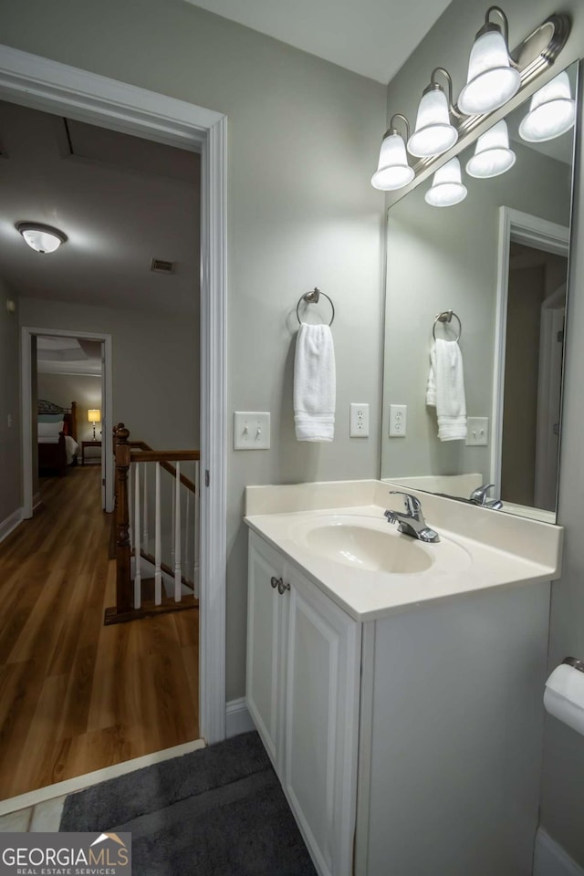 bathroom featuring wood-type flooring and vanity