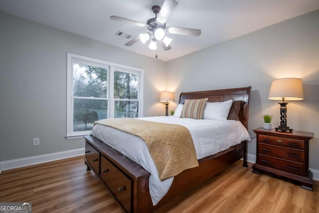 bedroom featuring wood-type flooring and ceiling fan