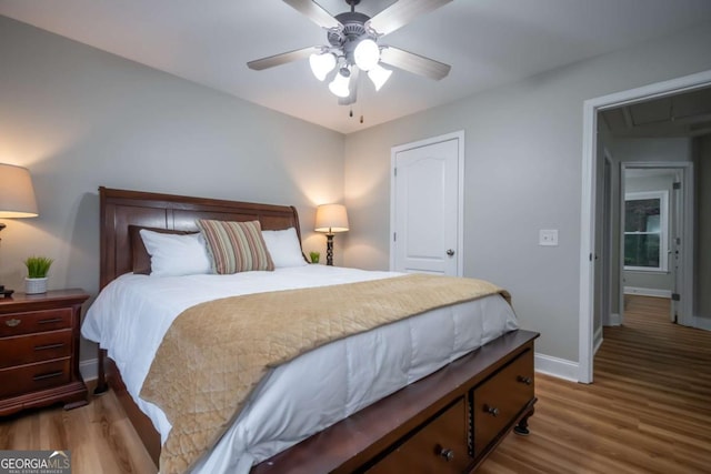 bedroom featuring wood-type flooring and ceiling fan