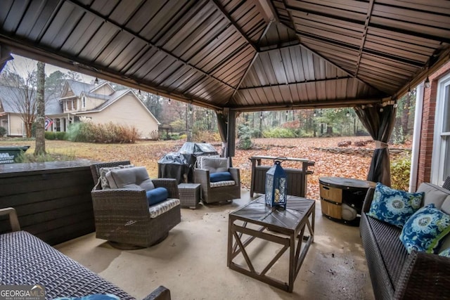 view of patio featuring a gazebo and outdoor lounge area