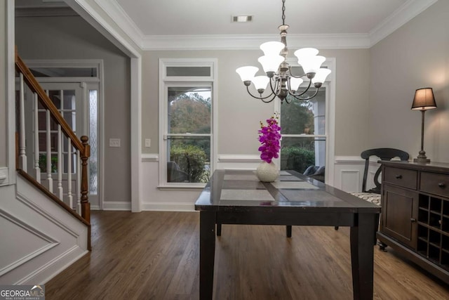 dining area with a wealth of natural light, crown molding, and dark wood-type flooring