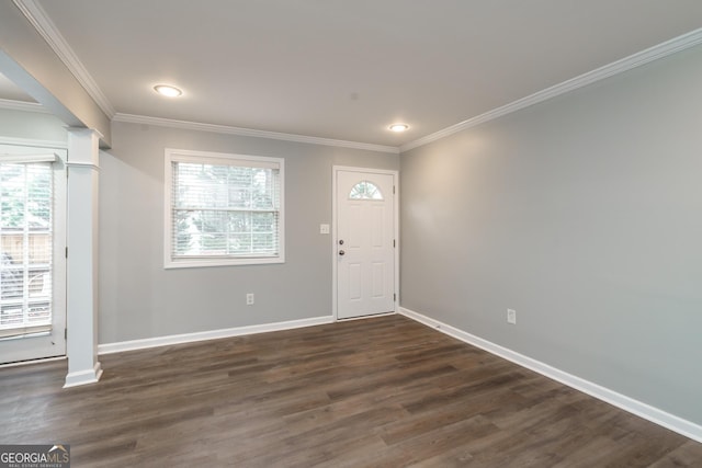 foyer entrance with dark wood-type flooring and ornamental molding