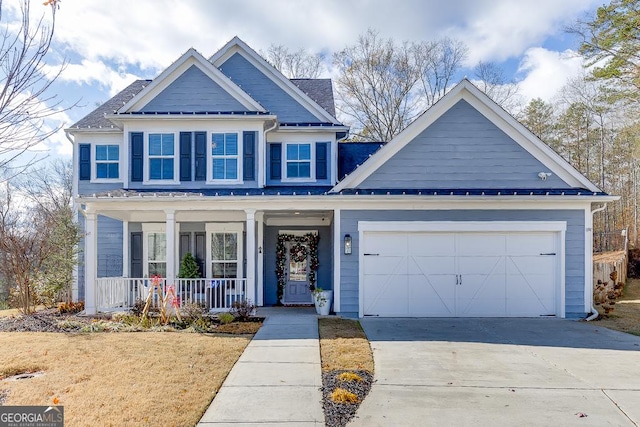 view of front of house with a porch and a garage