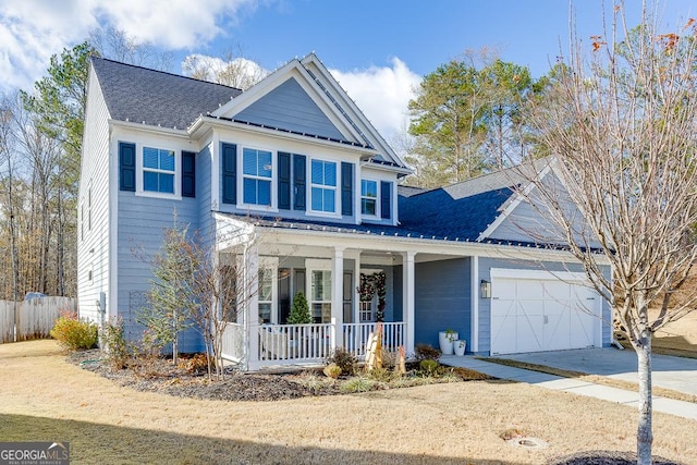 view of front of home with a porch and a garage