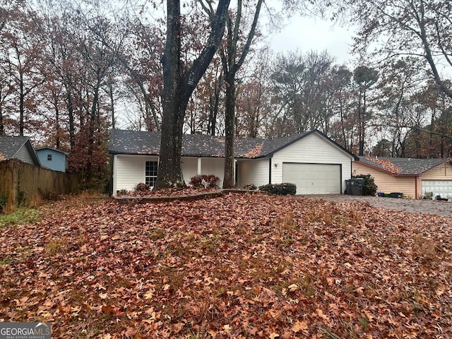 single story home with a garage