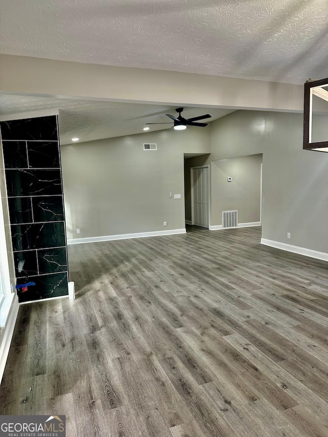 unfurnished living room featuring a textured ceiling, hardwood / wood-style flooring, and ceiling fan