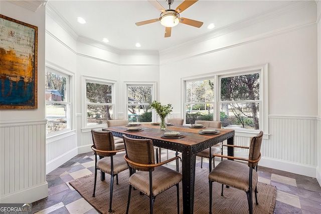 dining room with ceiling fan, ornamental molding, and plenty of natural light