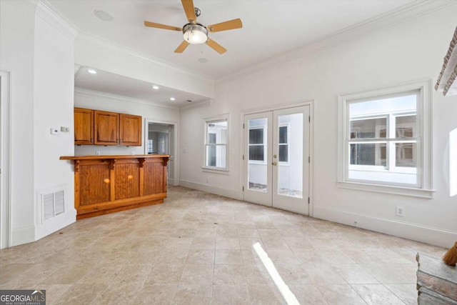 kitchen featuring crown molding, a breakfast bar area, ceiling fan, french doors, and kitchen peninsula