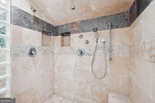 bathroom with tiled shower