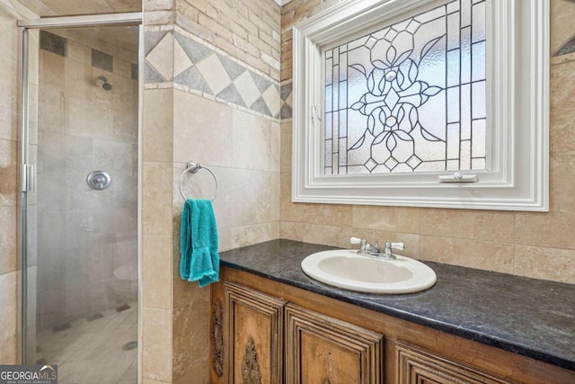 bathroom with vanity and a shower with shower door