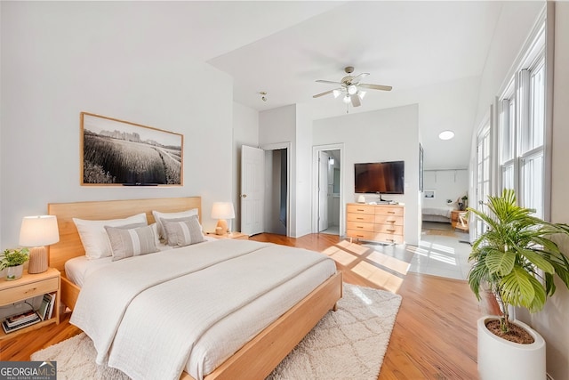 bedroom with ceiling fan and light hardwood / wood-style floors