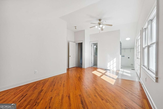 empty room featuring ceiling fan and light wood-type flooring