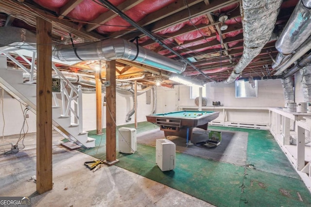 interior space with pool table and electric panel