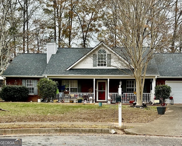 view of front of home with covered porch and a garage