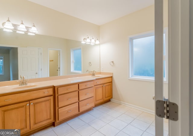 bathroom with tile patterned floors and vanity