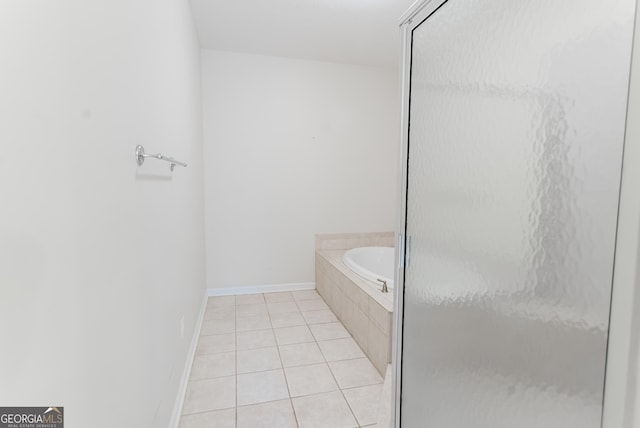 bathroom with tile patterned flooring and independent shower and bath