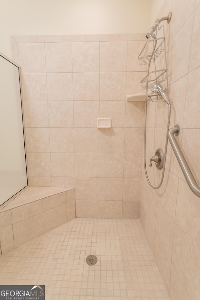 bathroom with tiled shower