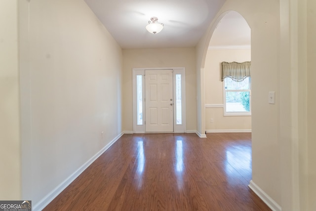 foyer featuring hardwood / wood-style flooring and ornamental molding