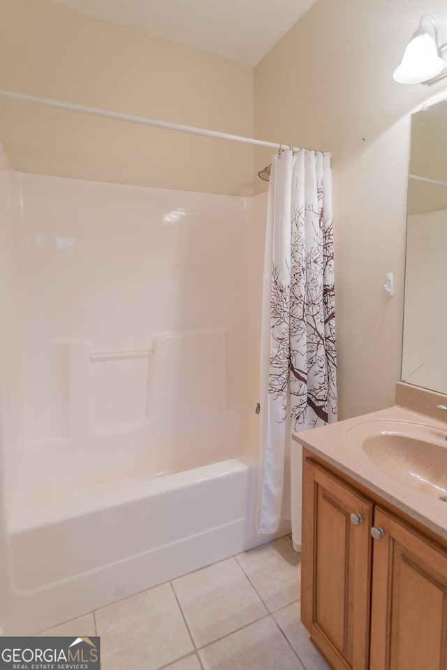 bathroom featuring tile patterned floors, vanity, and shower / bath combination with curtain